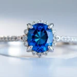 Engagement ring with sapphire showcasing a vibrant blue gemstone in a delicate platinum setting, ideal for symbolizing love and elegance.